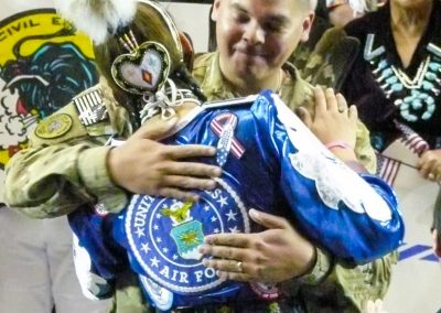 military captain hugging woman