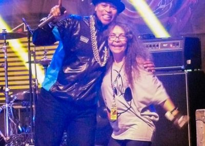 woman smiling with man on stage