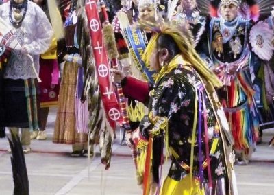 man marching with cane