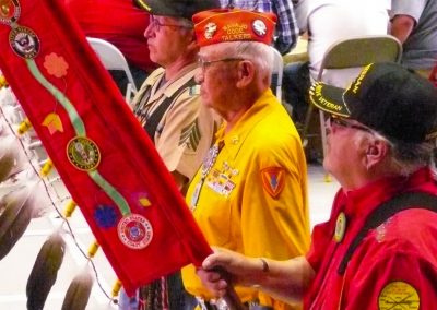 Veterans holding banner