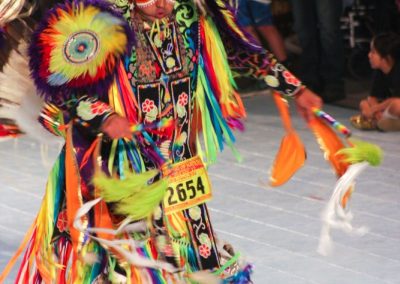 Man adorned with feathers