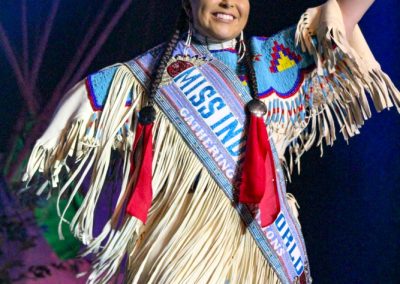 Miss Indian world waving