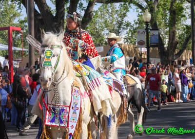 girl and man on horses