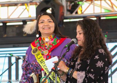 Miss Indian World contestant and the presenter talking