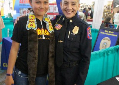 Police woman smiling with girl