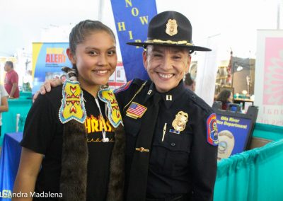 Police woman smiling with girl