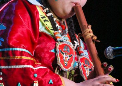 Miss Indian World contestant playing flute