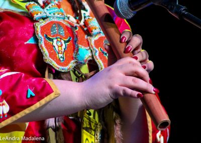 Miss Indian World contestant playing flute