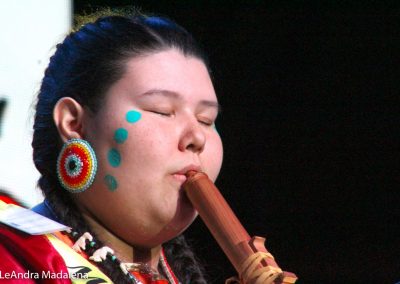 Miss Indian World contestant playing flute