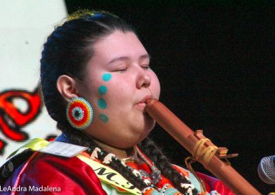 Miss Indian World contestant playing flute