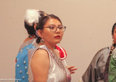 woman listening to speaker