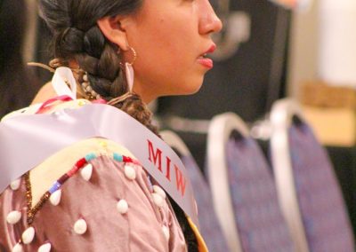 woman listening to speaker