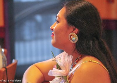 woman listening to Miss Indian World speak