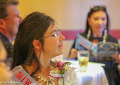 woman listening to Miss Indian World speak