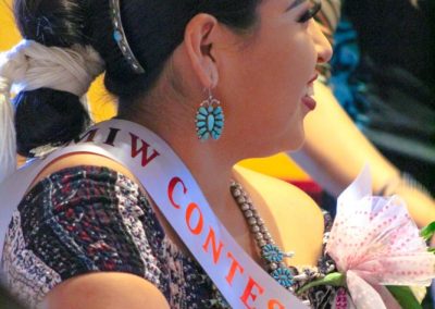 woman listening to Miss Indian World speak