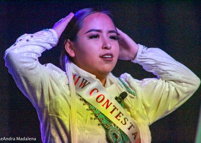 Miss Indian World contestant tying her hair