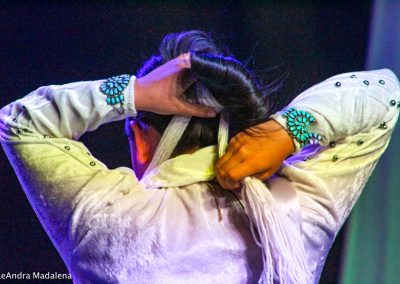 Miss Indian World contestant tying her hair