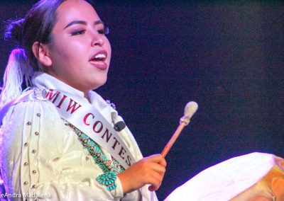 Miss Indian World contestant playing the drum