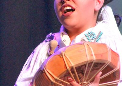 Miss Indian World contestant playing the drum
