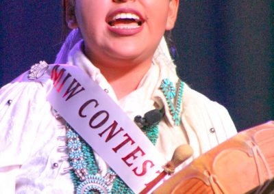 Miss Indian World contestant playing the drum