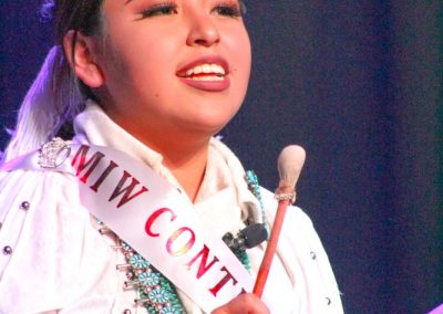 Miss Indian World contestant playing the drum