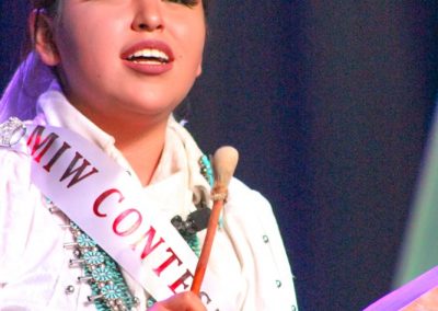 Miss Indian World contestant playing the drum