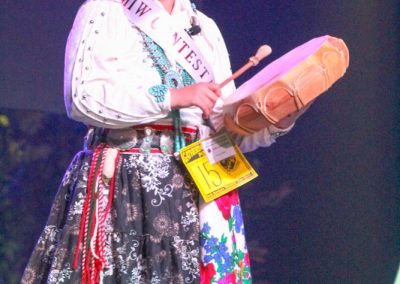 Miss Indian World contestant playing the drum