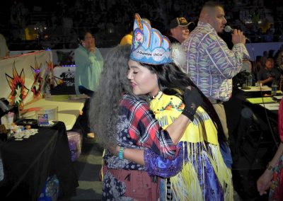 Miss Indian World hugging woman