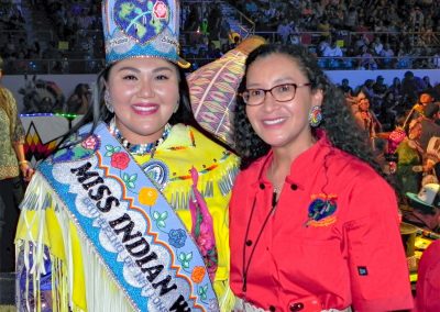 Miss Indian World smiling with participant