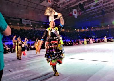 Miss Indian World contestant walking and waving to crowd