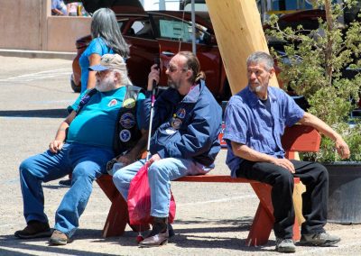 men sitting on a bench