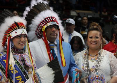 man in woman in headdresses