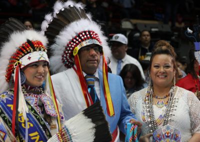 man in woman in headdresses