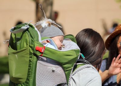 woman carrying baby on her back