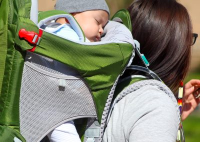 woman carrying baby on her back