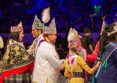 Women and Children shaking hands at Gathering of Nations