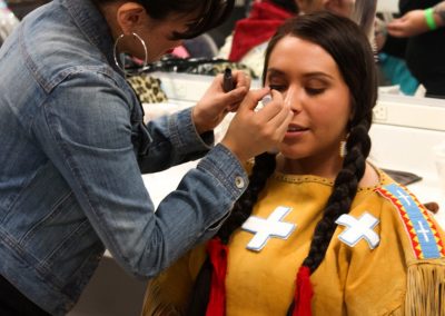 woman getting her makeup done