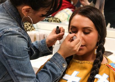 woman getting her makeup done