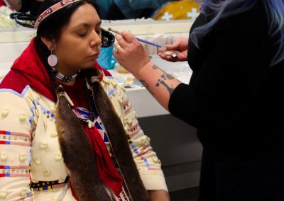 woman getting her makeup done