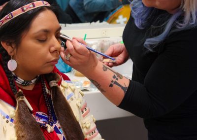 woman getting her makeup done