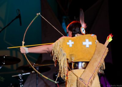 woman drawing her bow