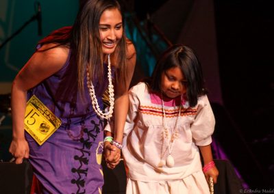 woman and child bow to audience