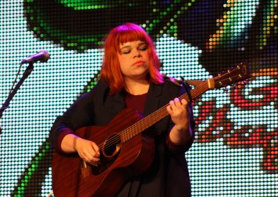 woman playing guitar