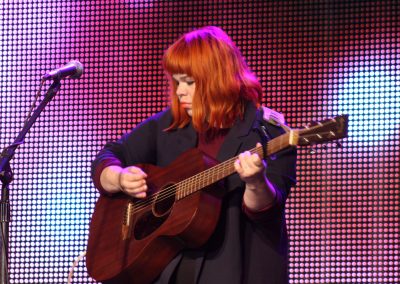 woman playing guitar