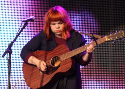 woman playing guitar